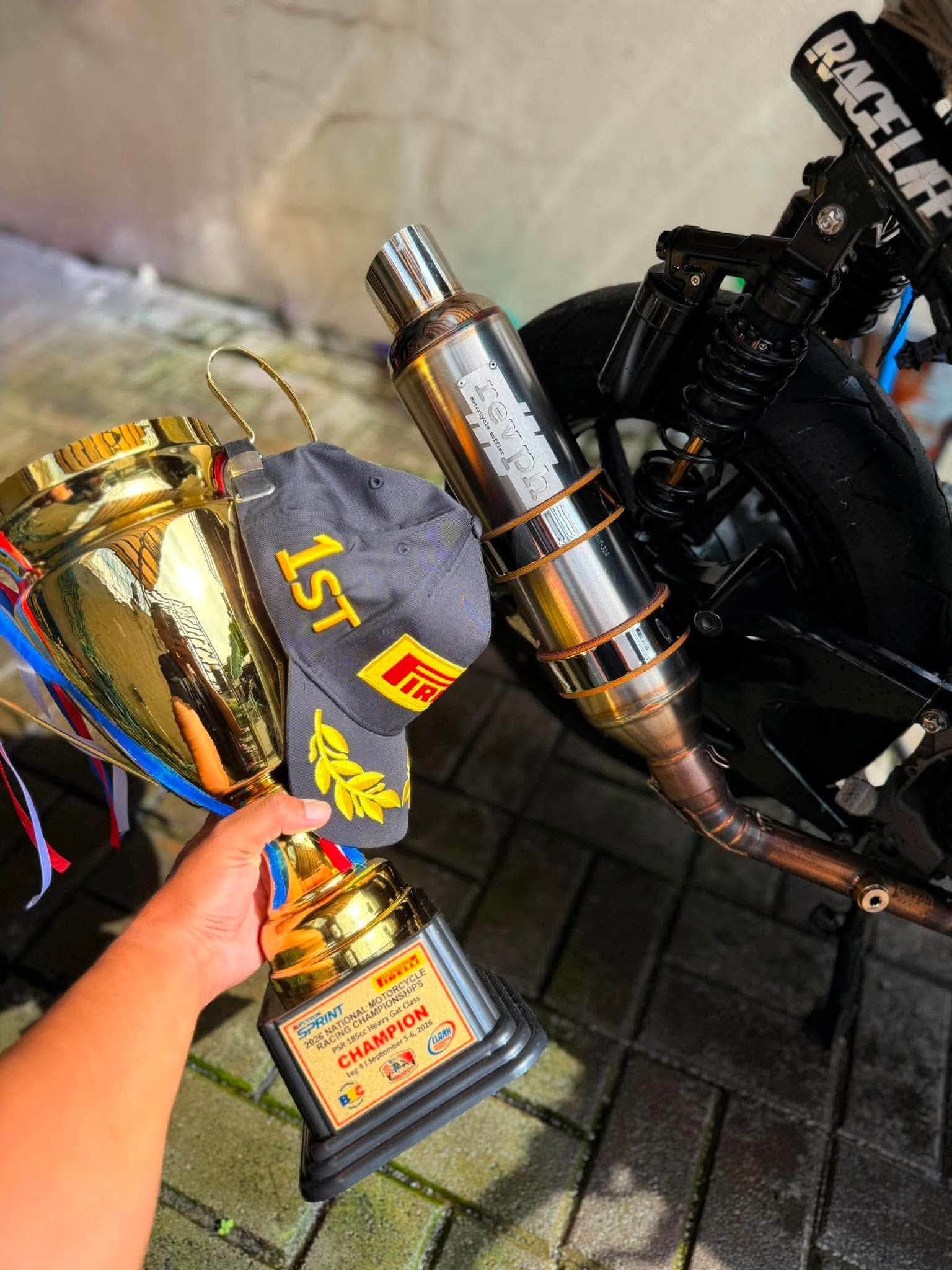 RevPH racing motorcycle with trophy and exhaust product